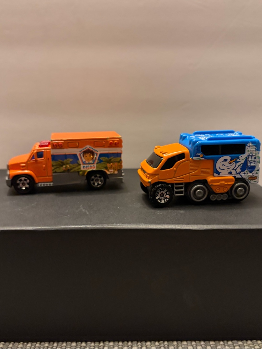 Lot of 2 Matchbox Trucks - Arctic Track Snow Truck & Go Diego Go Ambulance